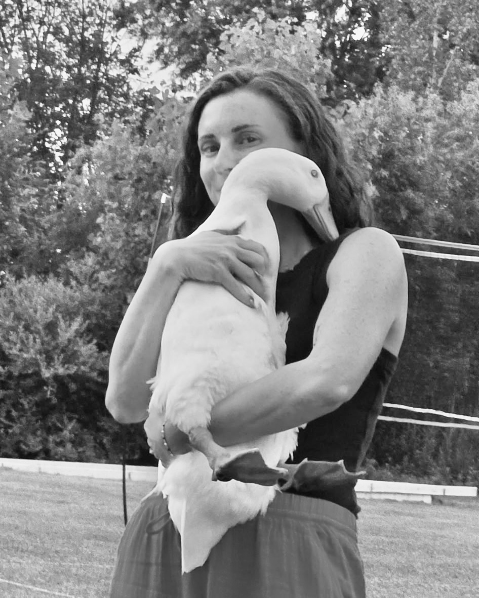 woman holding a big white duck