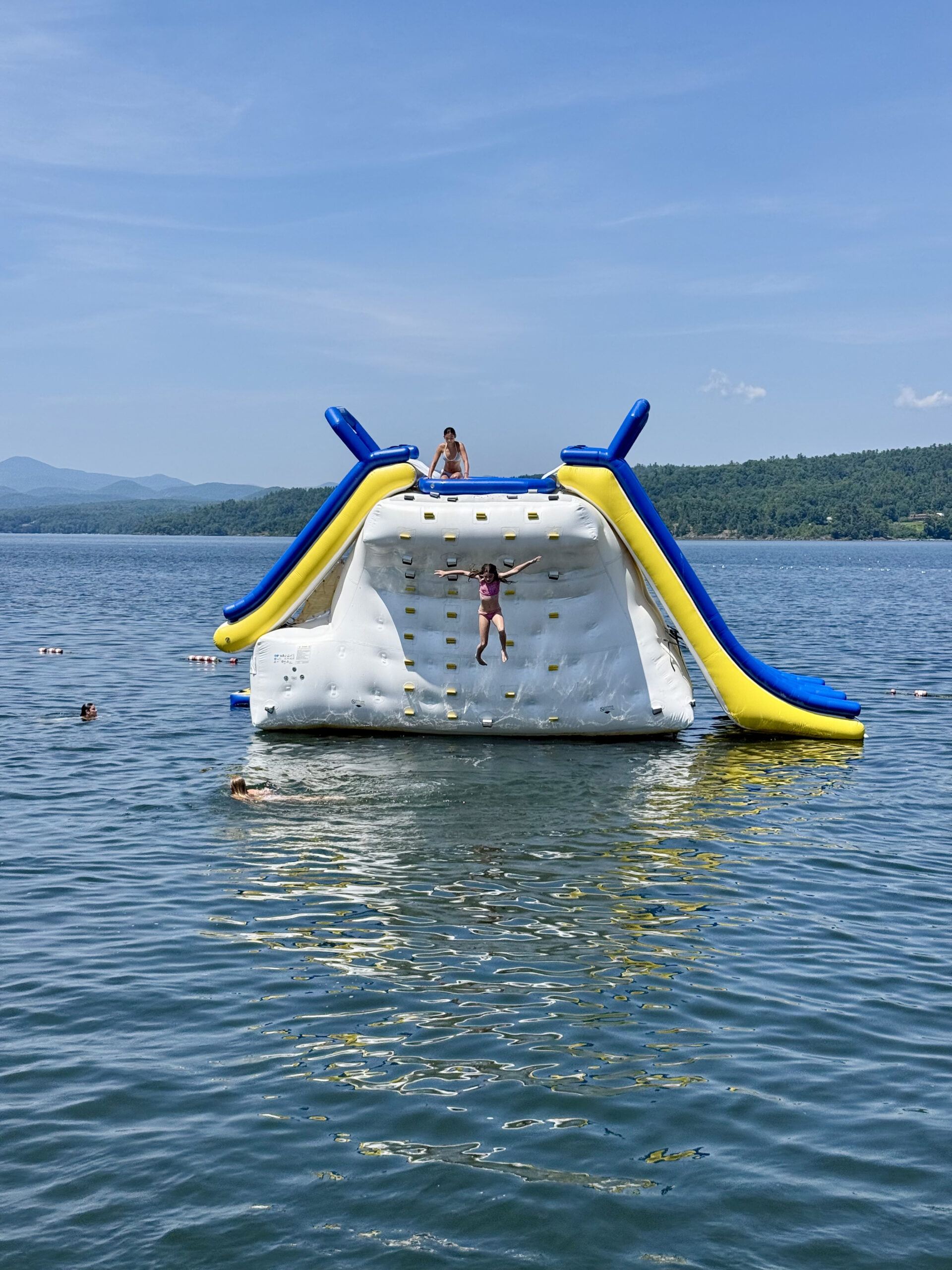 girls jumping off giant iceberg in middle of Lake Champlain