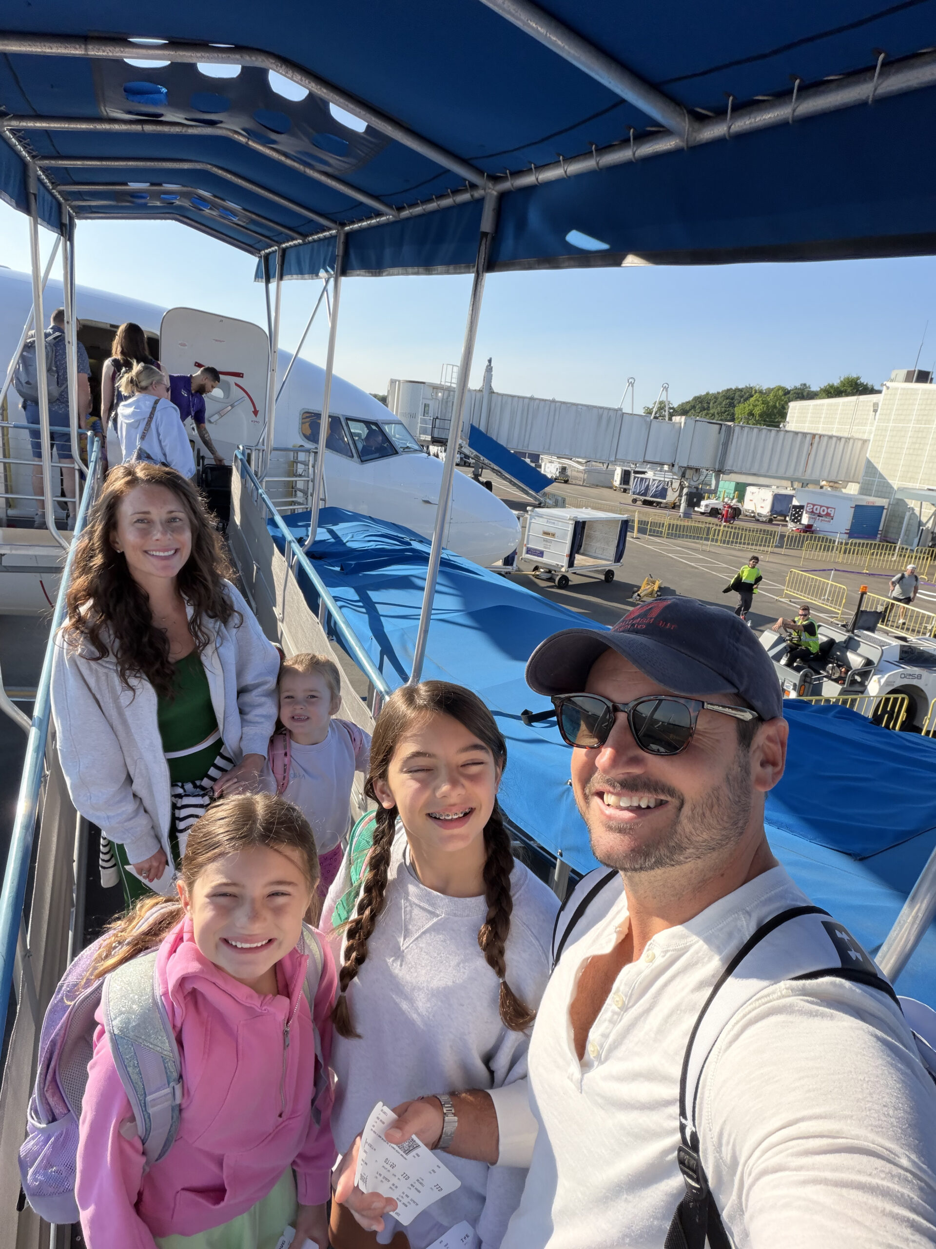 family selfie boarding plane summer confessions