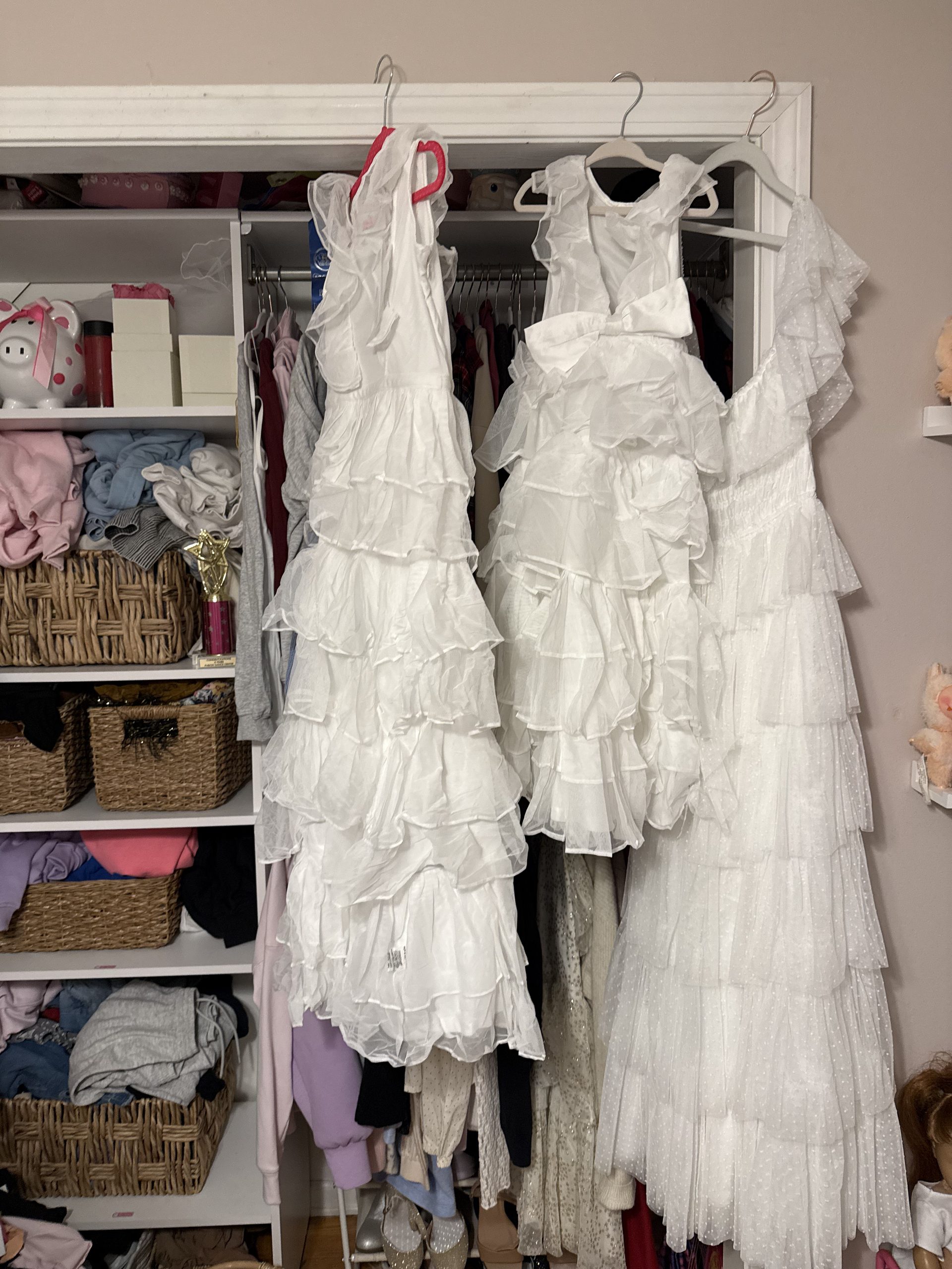 flower girl dresses hanging in closet for Italy