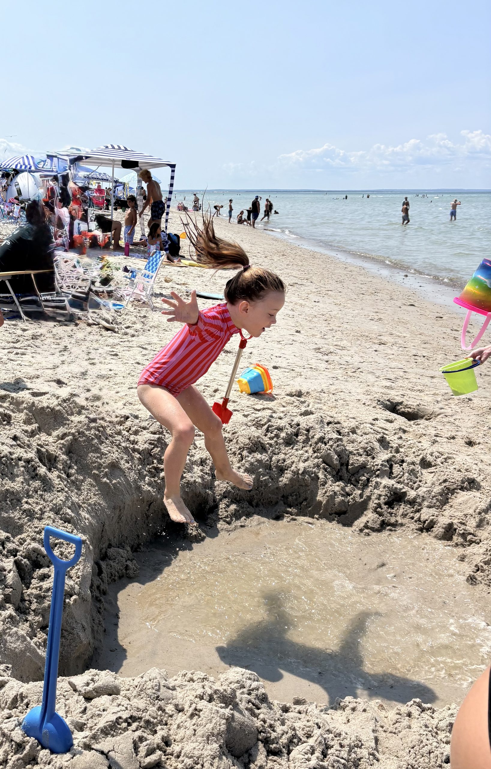 Toddler jumping into a hole in Cape Cod 2026